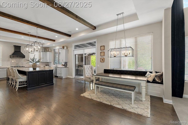 3610 Piccadilly Dr, Rochester Hills, MI 48309 - kitchen featuring wall chimney range hood, a chandelier, a center island, dishwasher, and beam ceiling