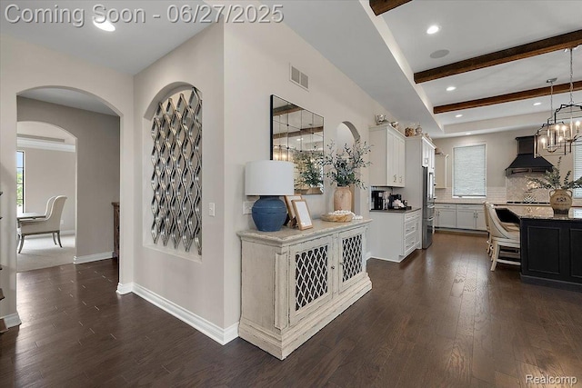 3610 Piccadilly Dr, Rochester Hills, MI 48309 - hall with dark wood-type flooring, arched walkways, beam ceiling, and recessed lighting