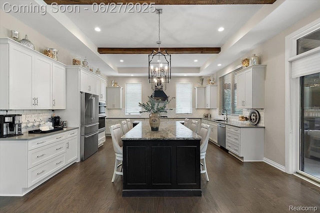 3610 Piccadilly Dr, Rochester Hills, MI 48309 - kitchen with appliances with stainless steel finishes, a breakfast bar, a center island, decorative backsplash, and recessed lighting