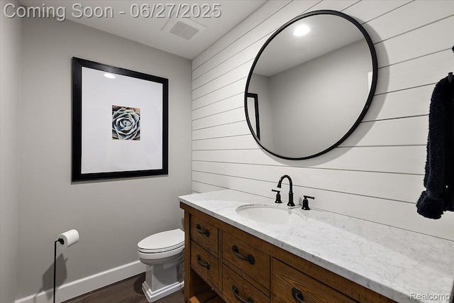 3610 Piccadilly Dr, Rochester Hills, MI 48309 - bathroom with vanity, wood finished floors, and wooden walls