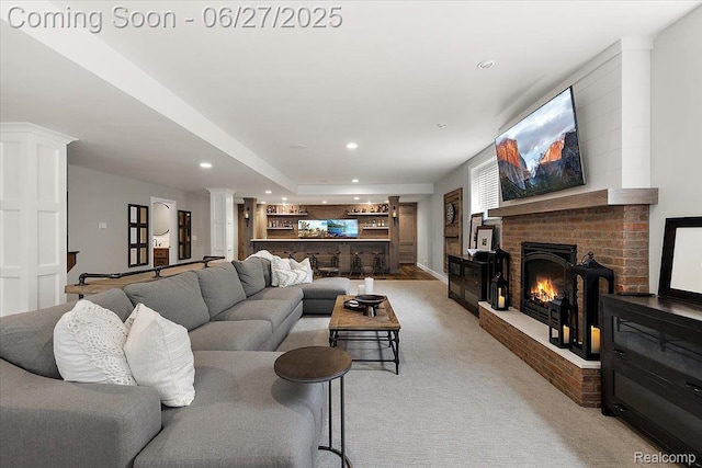 3610 Piccadilly Dr, Rochester Hills, MI 48309 - living area with recessed lighting, a brick fireplace, light carpet, ornate columns, and bar