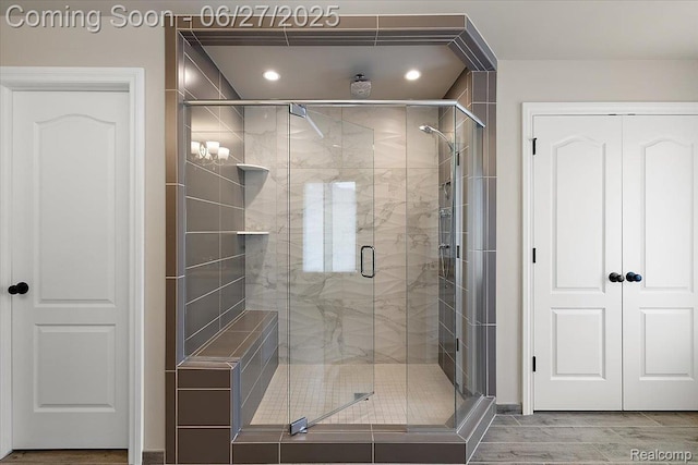 3610 Piccadilly Dr, Rochester Hills, MI 48309 - bathroom featuring a shower stall, recessed lighting, and wood finished floors