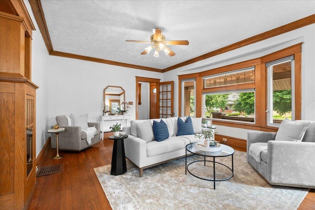 1122 Martin Luther King Jr St SE, Grand Rapids, MI 49507 - living area with dark wood-style flooring, a ceiling fan, ornamental molding, and baseboards
