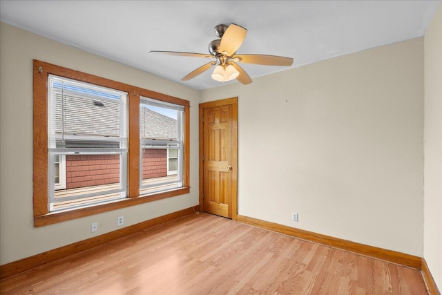 1122 Martin Luther King Jr St SE, Grand Rapids, MI 49507 - unfurnished room featuring light wood-style flooring, baseboards, and ceiling fan