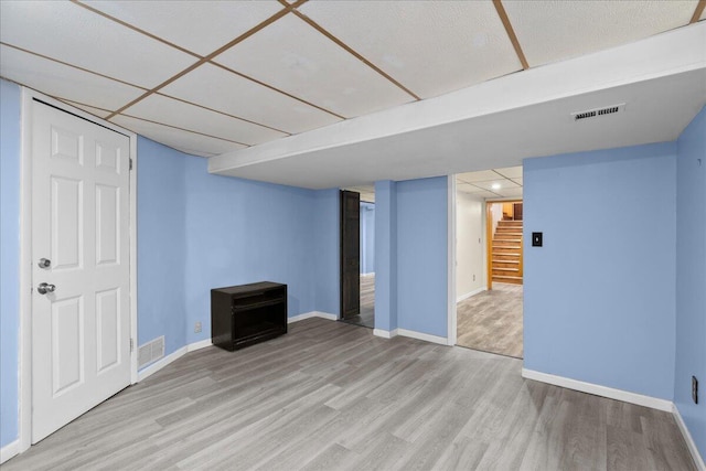 1122 Martin Luther King Jr St SE, Grand Rapids, MI 49507 - finished below grade area featuring light wood-type flooring, stairway, and baseboards
