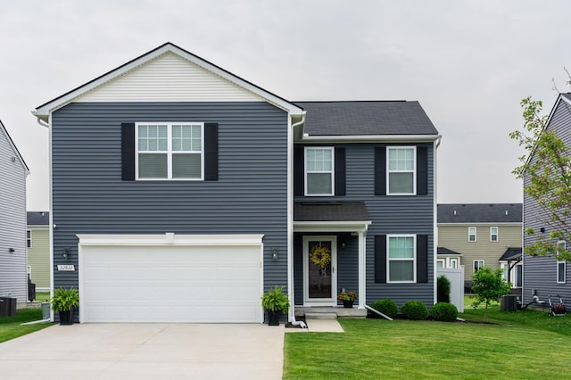 32822 Ravine St, New Haven, MI 48048 - traditional-style house with a front lawn, driveway, an attached garage, and cooling unit