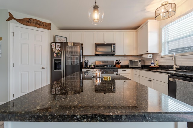 32822 Ravine St, New Haven, MI 48048 - kitchen with appliances with stainless steel finishes, a sink, a spacious island, and tasteful backsplash