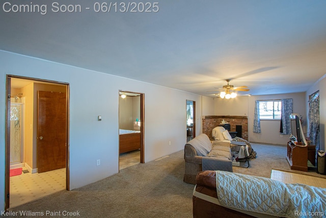 525 E Saint Clair St, Almont, MI 48003 - carpeted living room with a fireplace and a ceiling fan