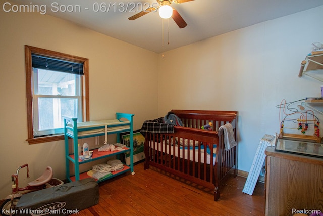 525 E Saint Clair St, Almont, MI 48003 - bedroom with wood finished floors and ceiling fan