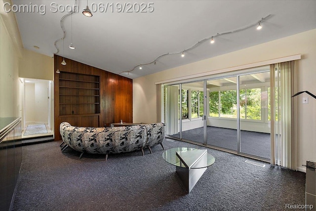 2732 Lone Pine Rd, West Bloomfield, MI 48323 - carpeted living area with vaulted ceiling, rail lighting, and built in features