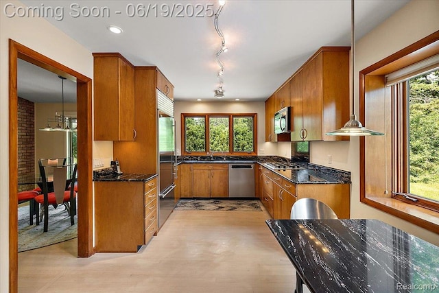 2732 Lone Pine Rd, West Bloomfield, MI 48323 - kitchen featuring stainless steel appliances, brown cabinets, light wood-style flooring, recessed lighting, and dark stone counters