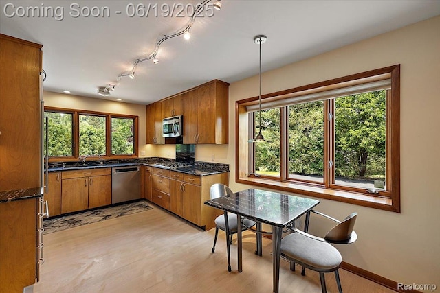 2732 Lone Pine Rd, West Bloomfield, MI 48323 - kitchen featuring stainless steel appliances, brown cabinets, and light wood-style floors