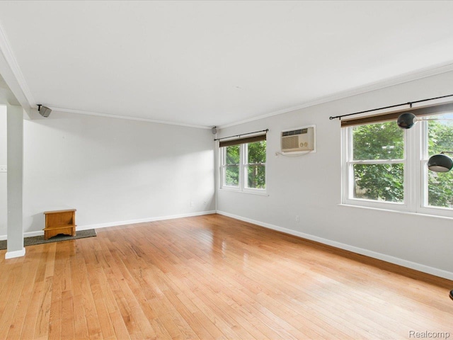 810 Holland Ave Unit 5, Port Huron, MI 48060 - empty room with a wall mounted AC, crown molding, and light wood-type flooring