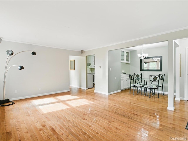 810 Holland Ave Unit 5, Port Huron, MI 48060 - unfurnished living room with ornamental molding, a chandelier, and light wood-type flooring