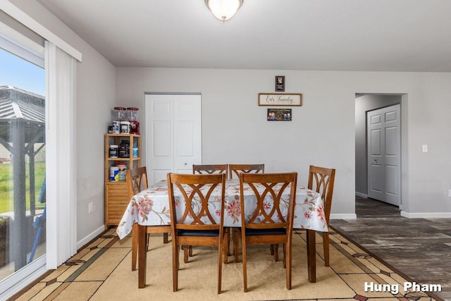 5764 Kiverton Ridge Dr SE, Grand Rapids, MI 49508 - dining space featuring baseboards and light wood-style flooring