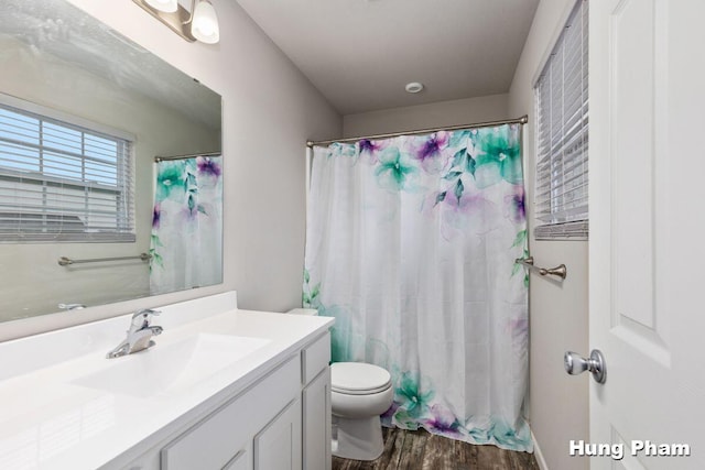 5764 Kiverton Ridge Dr SE, Grand Rapids, MI 49508 - full bath with wood finished floors, vanity, and toilet