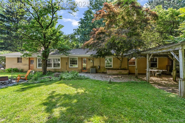 23385 Hunters Ln, Southfield, MI 48033 - rear view of house featuring a lawn and a patio