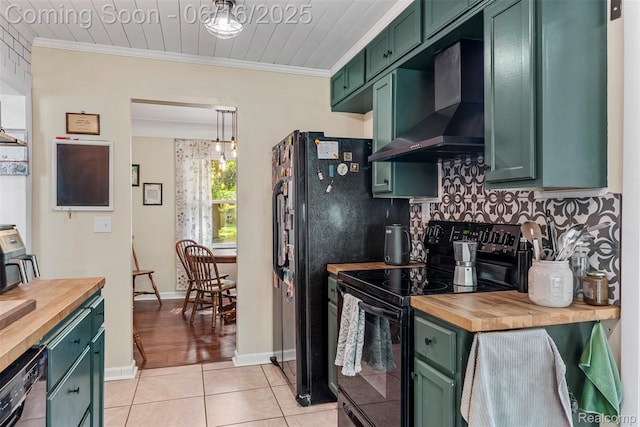 23385 Hunters Ln, Southfield, MI 48033 - kitchen with green cabinetry, butcher block counters, black range with electric stovetop, wall chimney range hood, and ornamental molding