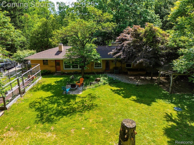 23385 Hunters Ln, Southfield, MI 48033 - view of grassy yard with a garden and a patio area