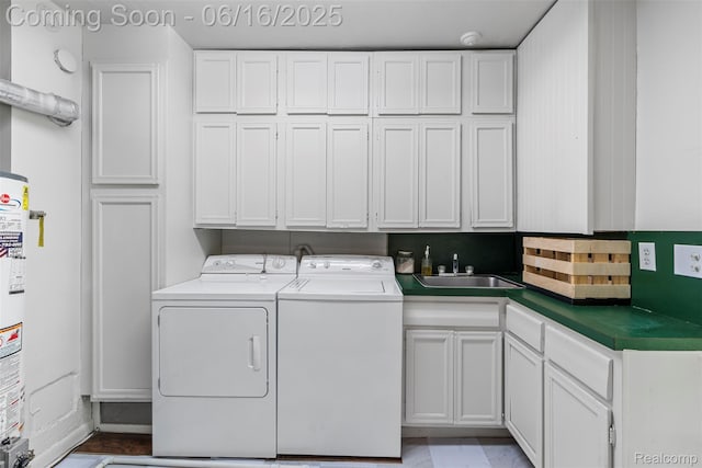 23385 Hunters Ln, Southfield, MI 48033 - washroom with cabinet space, washer and dryer, and gas water heater