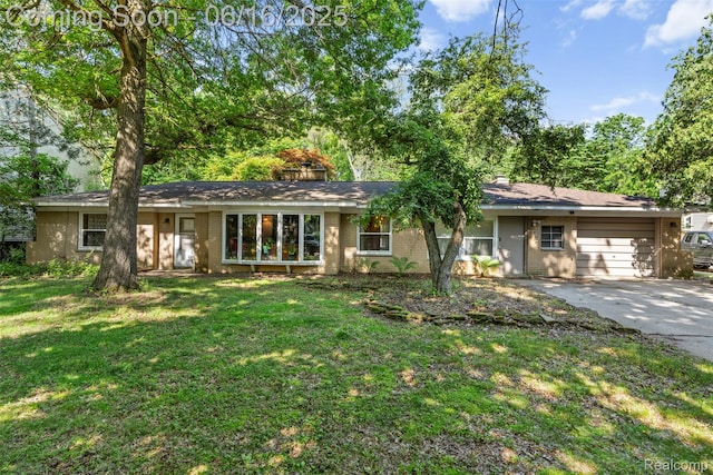 23385 Hunters Ln, Southfield, MI 48033 - ranch-style home with driveway, brick siding, a front lawn, and a garage