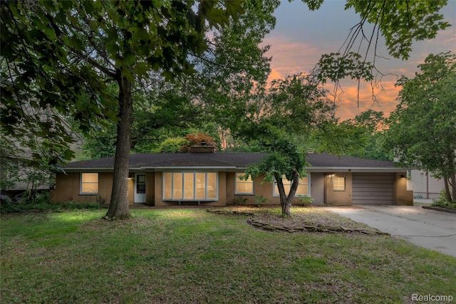 23385 Hunters Ln, Southfield, MI 48033 - single story home featuring concrete driveway, a front yard, and brick siding