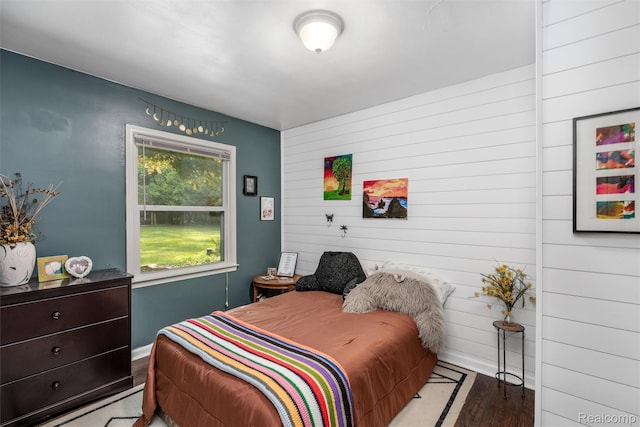 23385 Hunters Ln, Southfield, MI 48033 - bedroom featuring wood finished floors and wooden walls