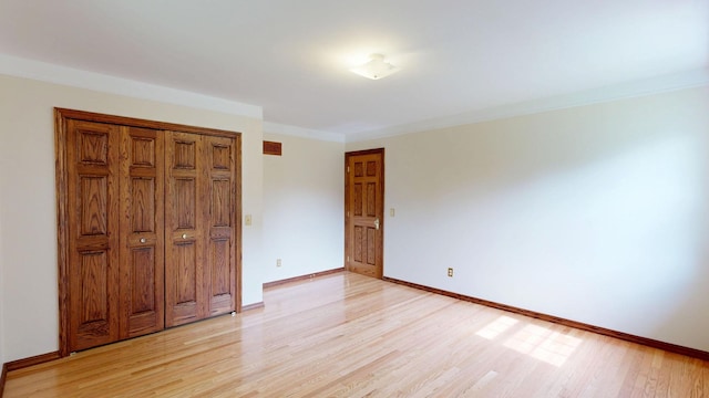 12148 N Elms Rd, Clio, MI 48420 - unfurnished bedroom with light wood-style flooring and baseboards