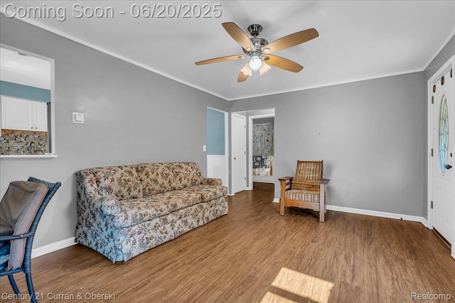 24121 Kraft Pl, Brownstown, MI 48174 - sitting room with a ceiling fan, ornamental molding, and wood finished floors