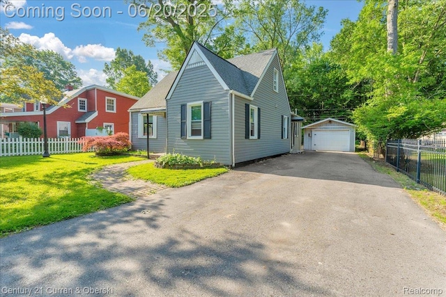 24121 Kraft Pl, Brownstown, MI 48174 - view of front of home with driveway, a garage, an outdoor structure, and roof with shingles