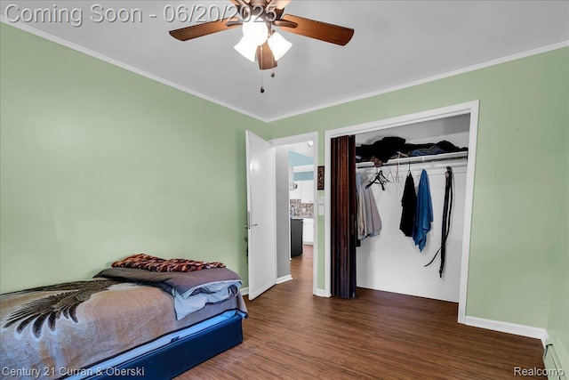 24121 Kraft Pl, Brownstown, MI 48174 - bedroom featuring ornamental molding, wood finished floors, a closet, and ceiling fan