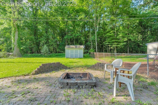 24121 Kraft Pl, Brownstown, MI 48174 - view of yard featuring an outdoor fire pit, a shed, and a patio area