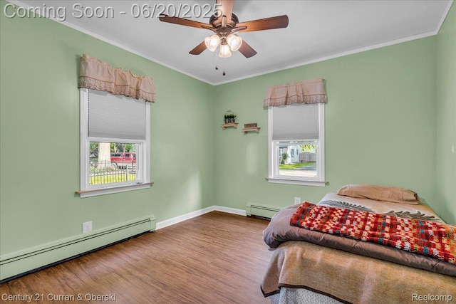 24121 Kraft Pl, Brownstown, MI 48174 - bedroom with baseboard heating, wood finished floors, ornamental molding, and ceiling fan
