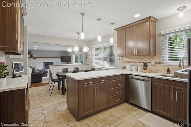 6821 Tamerlane Dr, West Bloomfield, MI 48322 - kitchen featuring dishwasher, a peninsula, open floor plan, decorative backsplash, and healthy amount of natural light