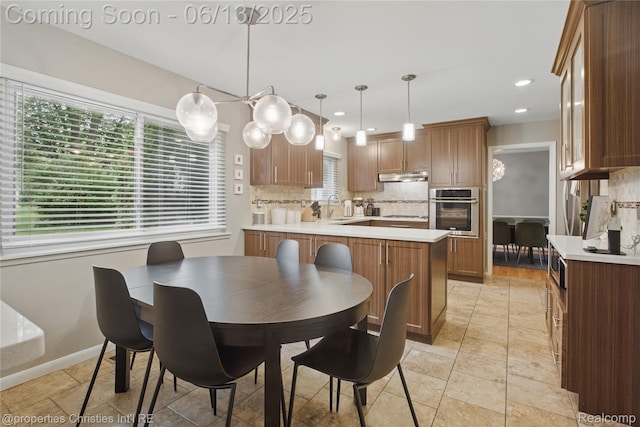 6821 Tamerlane Dr, West Bloomfield, MI 48322 - dining area featuring recessed lighting and light stone finish floors