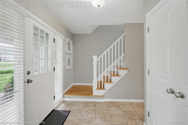 6821 Tamerlane Dr, West Bloomfield, MI 48322 - foyer with stairs and baseboards