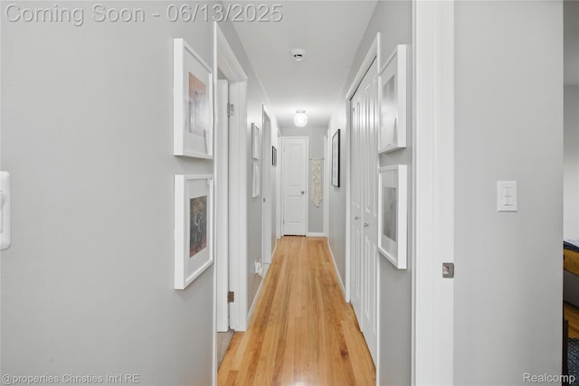 6821 Tamerlane Dr, West Bloomfield, MI 48322 - corridor featuring light wood-type flooring