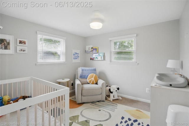6821 Tamerlane Dr, West Bloomfield, MI 48322 - bedroom featuring a nursery area, multiple windows, and carpet