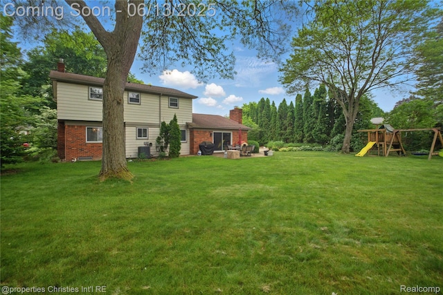 6821 Tamerlane Dr, West Bloomfield, MI 48322 - view of green lawn with a playground and a patio area