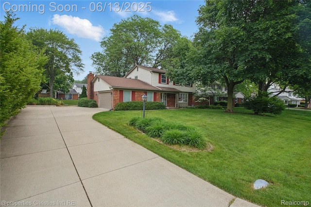6821 Tamerlane Dr, West Bloomfield, MI 48322 - traditional-style house with concrete driveway, brick siding, a front lawn, and an attached garage
