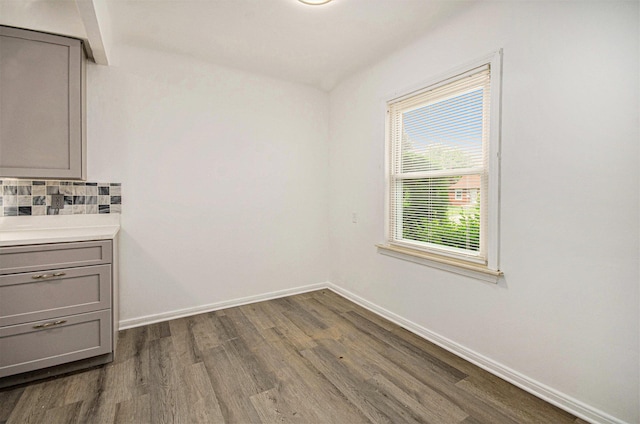 16086 Carlisle St, Detroit, MI 48205 - unfurnished dining area featuring dark wood-style floors and baseboards