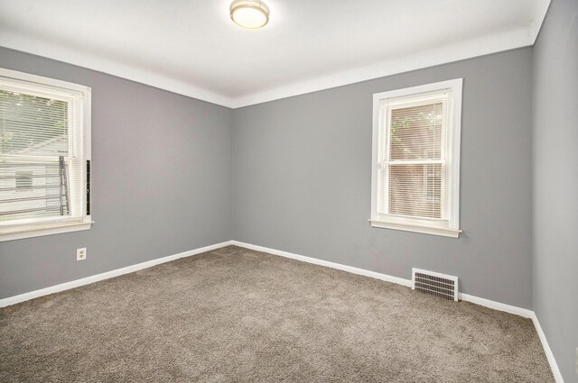 16086 Carlisle St, Detroit, MI 48205 - spare room featuring carpet and baseboards