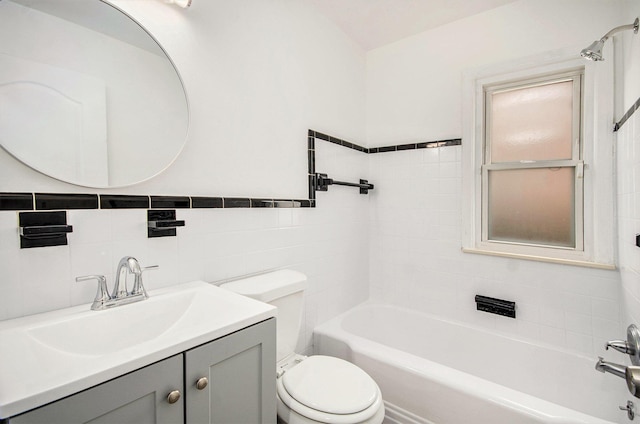 16086 Carlisle St, Detroit, MI 48205 - full bathroom featuring toilet, vanity,  shower combination, and tile walls