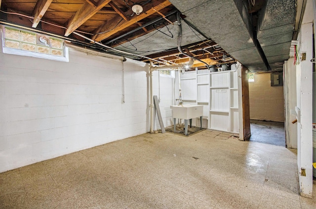 16086 Carlisle St, Detroit, MI 48205 - basement with tile patterned floors, a sink, concrete block wall, and electric panel