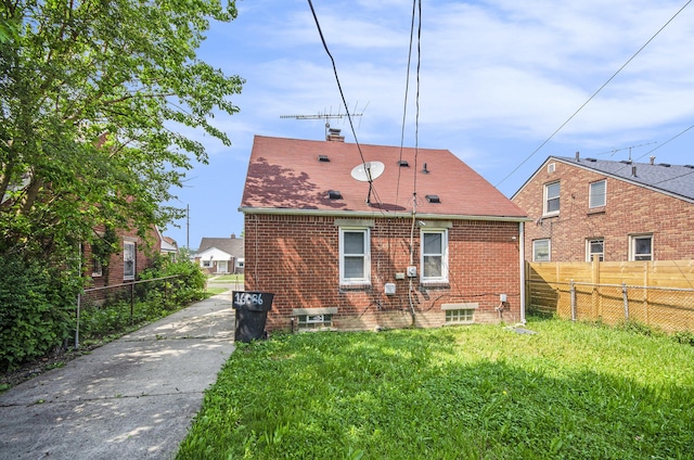 16086 Carlisle St, Detroit, MI 48205 - back of property featuring a chimney and brick siding
