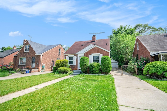 16086 Carlisle St, Detroit, MI 48205 - bungalow-style home featuring brick siding, a gate, a chimney, and a detached garage