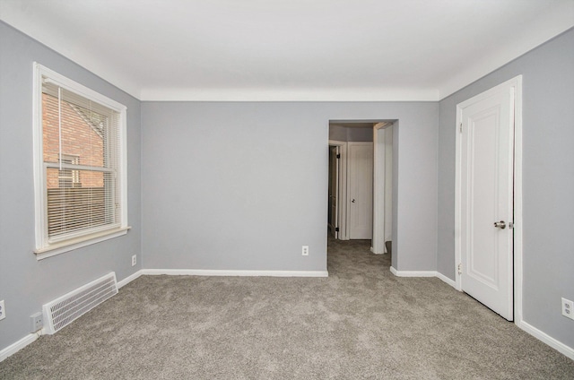 16086 Carlisle St, Detroit, MI 48205 - unfurnished bedroom with carpet floors and baseboards