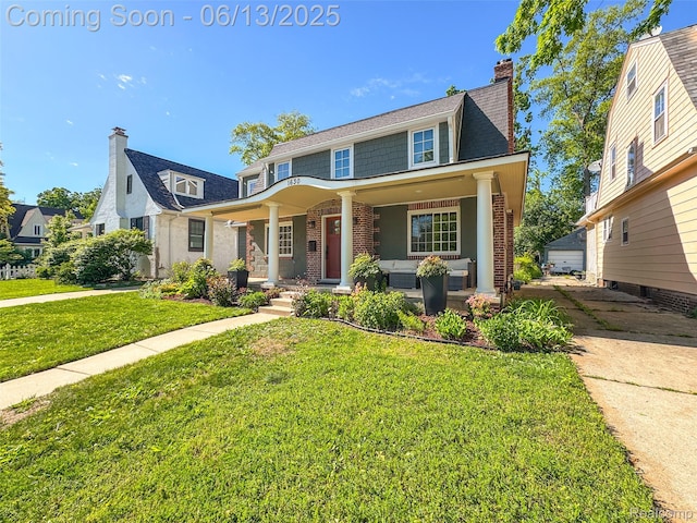 1630 W Houstonia Ave, Royal Oak, MI 48073 - view of front of house featuring covered porch, a front lawn, a chimney, brick siding, and outdoor lounge area