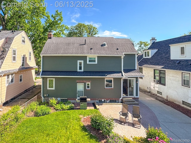1630 W Houstonia Ave, Royal Oak, MI 48073 - rear view of property featuring a patio, roof with shingles, and a chimney