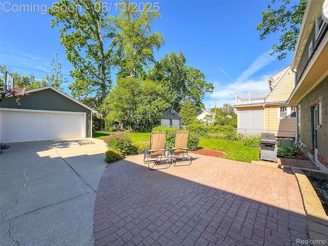 1630 W Houstonia Ave, Royal Oak, MI 48073 - view of patio with a grill, an outbuilding, and a garage